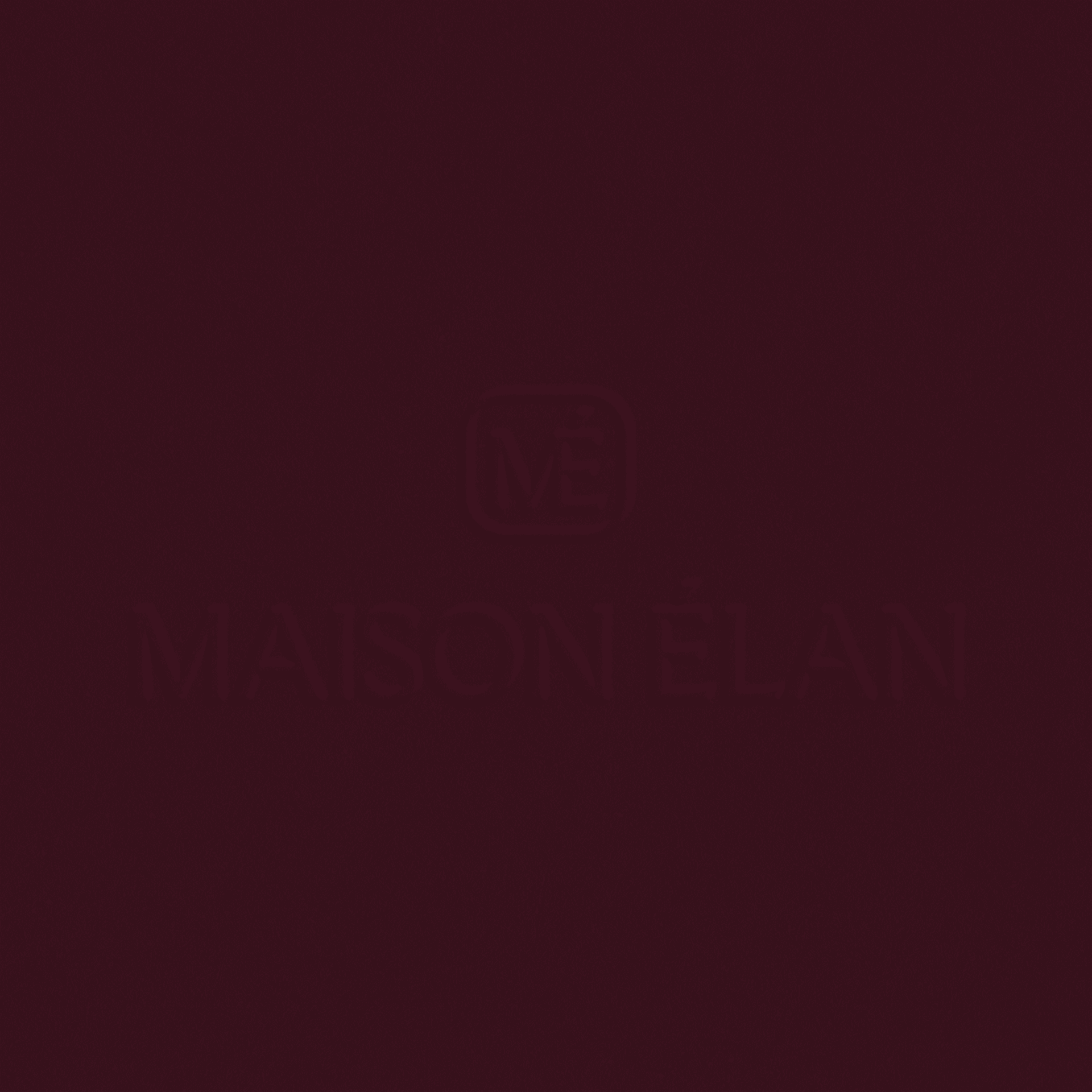 The logo for Maison Élan, a fashion brand, embossed onto a burgandy background.