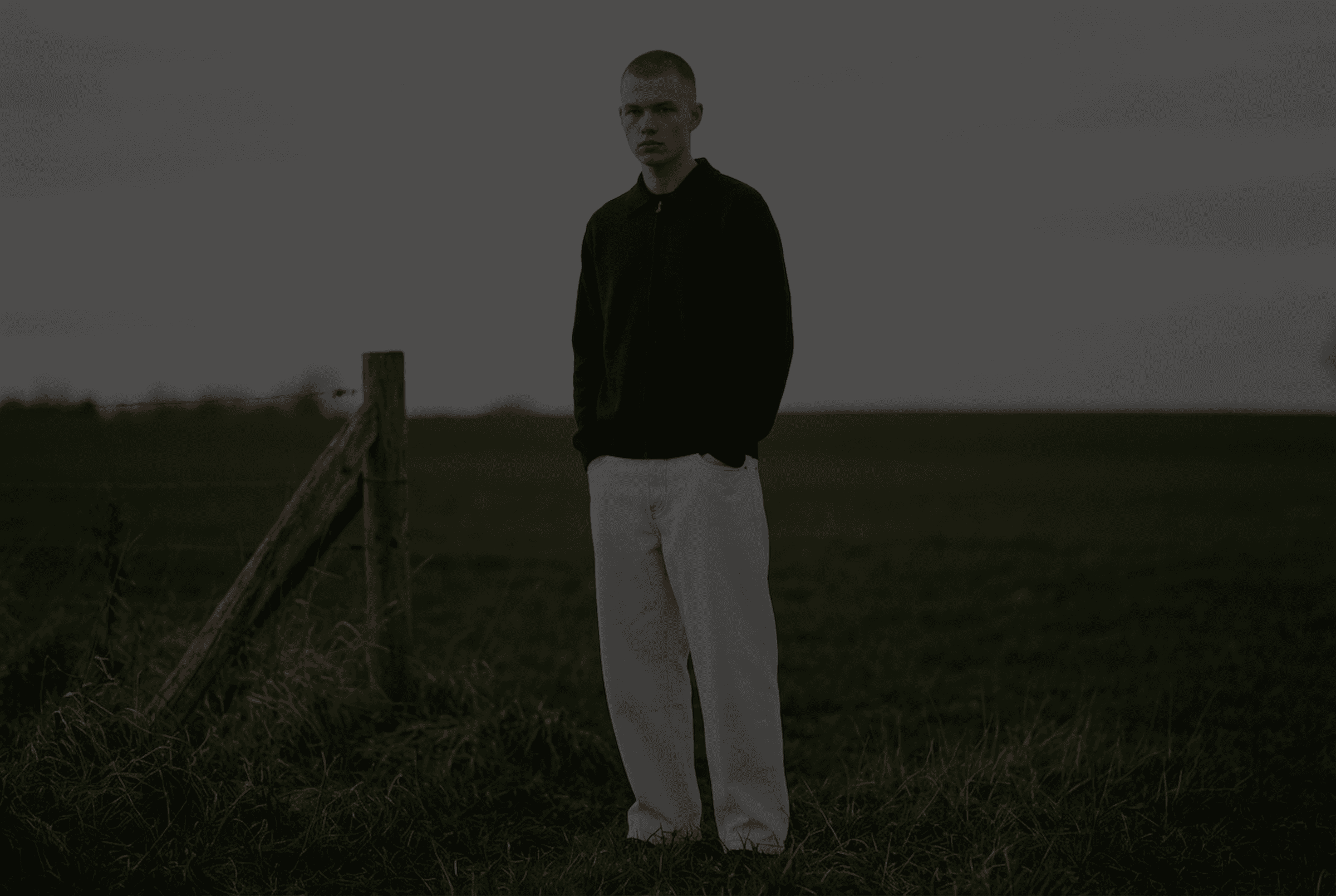 a blurry photo of a person standing in front of a window