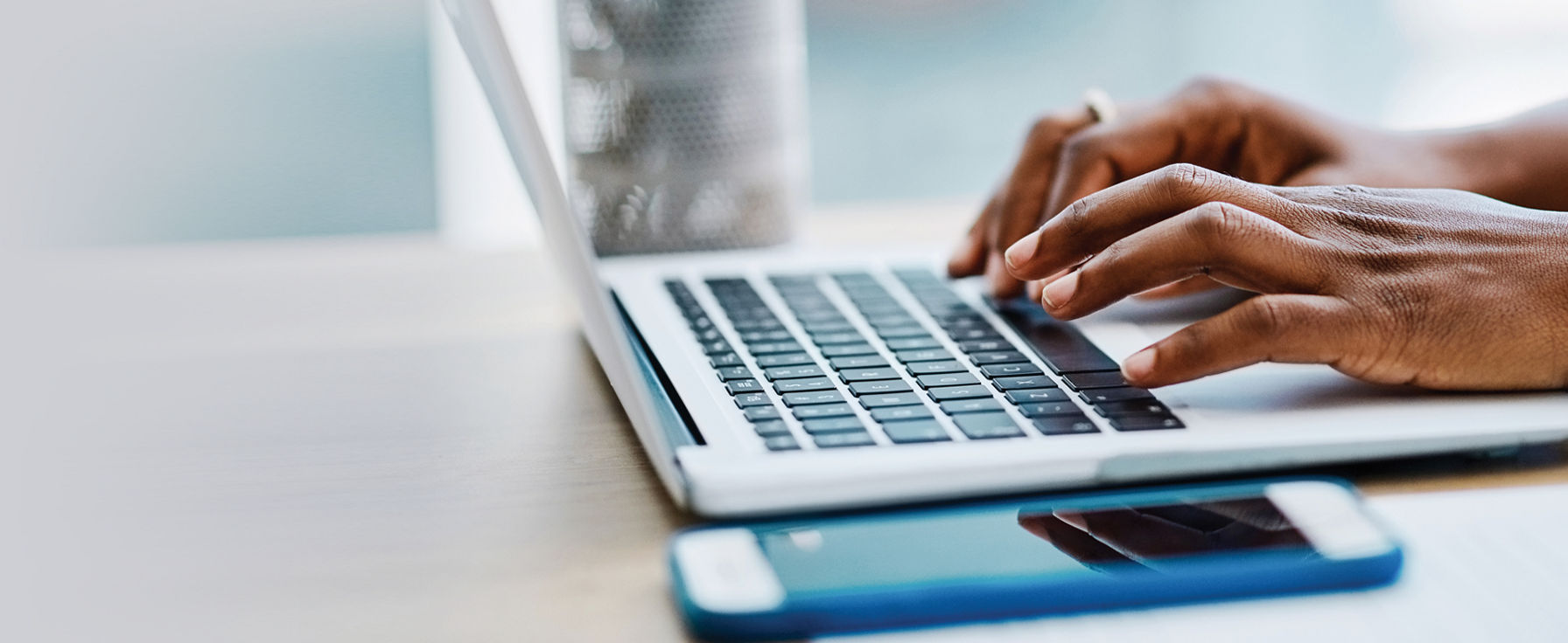 Person typing on a laptop