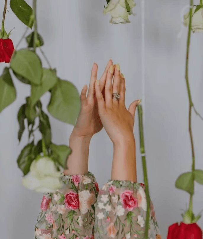 creative portrait of ahnds and flowers in Impel Devise, CA