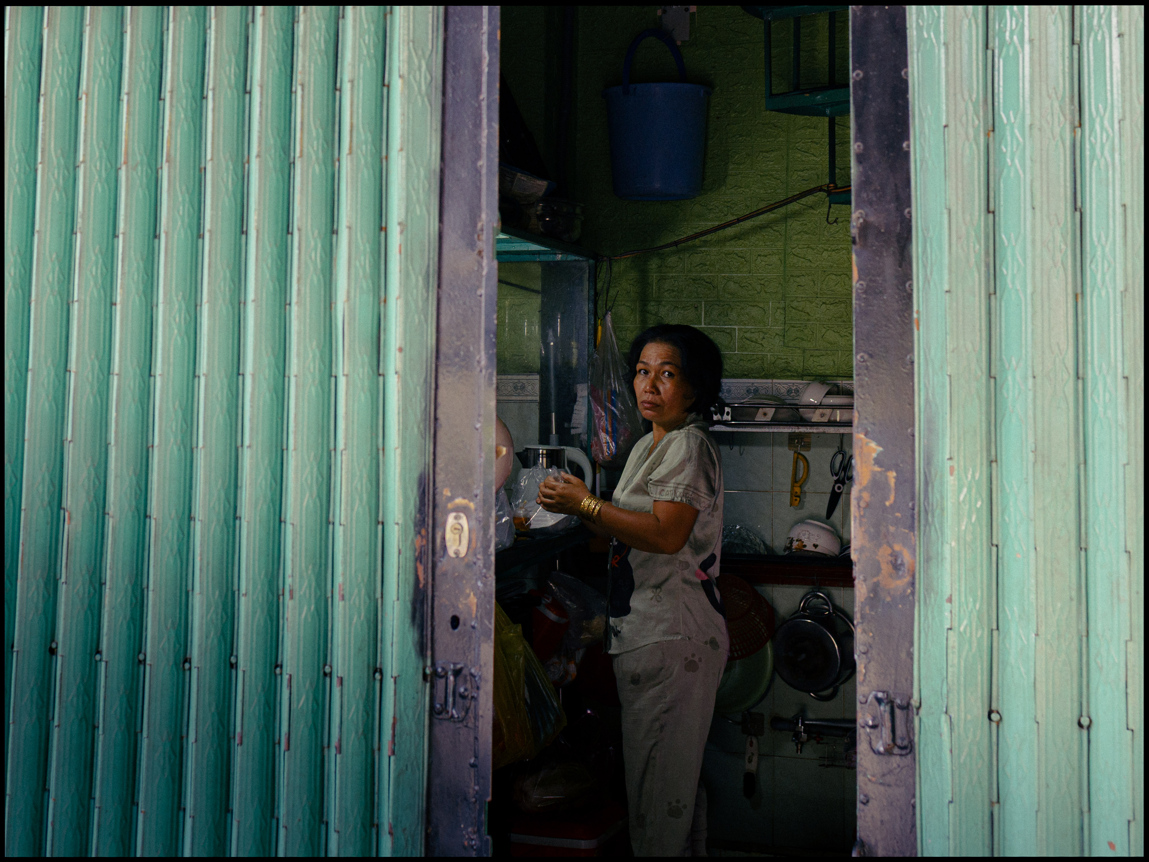 Male sailor from the ACS Independent team focused on steering his boat during the A Division race action.