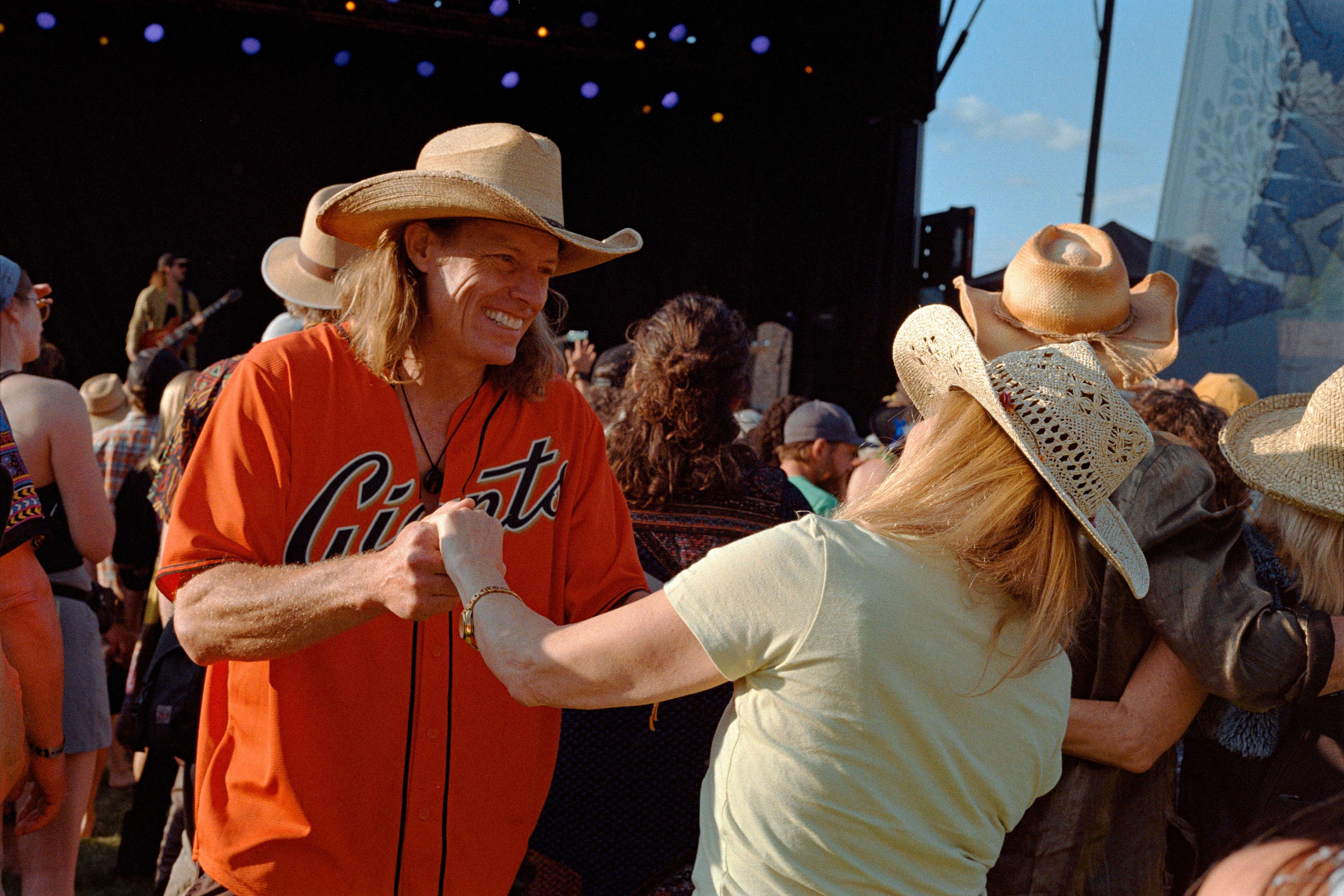 A crowd dancing at a music festival.