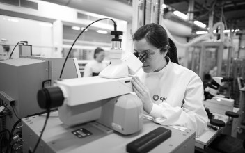 A photo of a CPI lab scientist using lab equipment