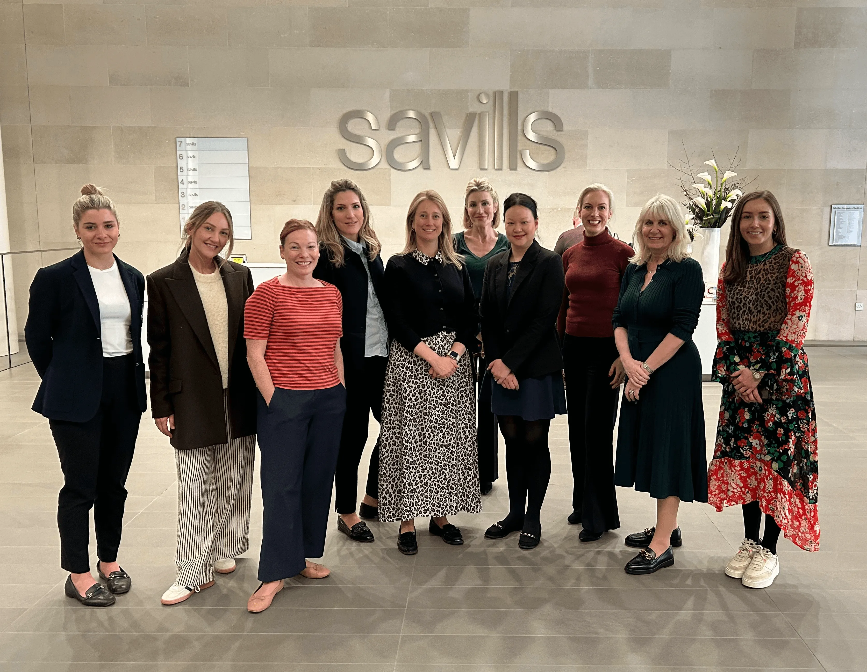 Group of business women posing for camera