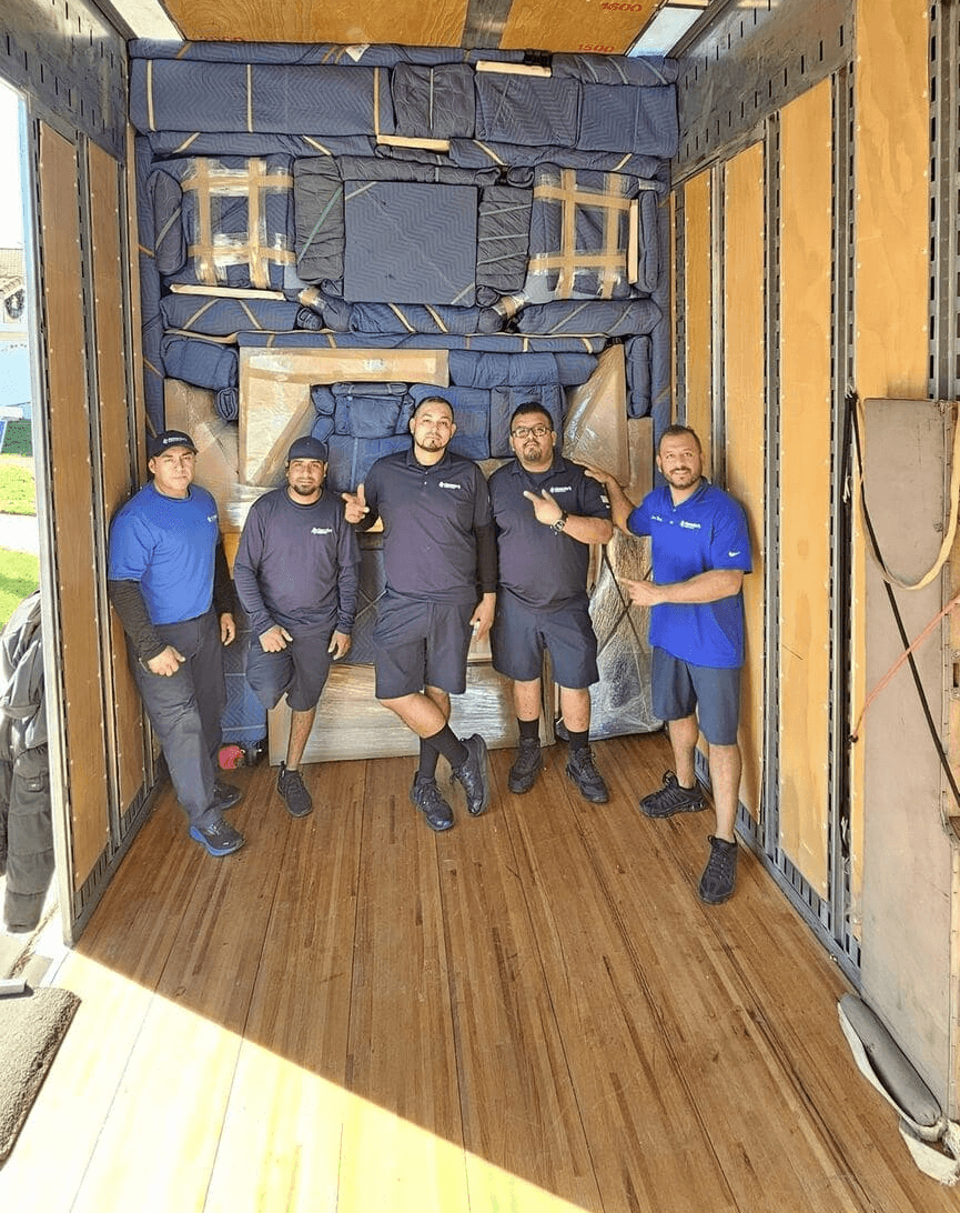 skilled movers labor inside the truck