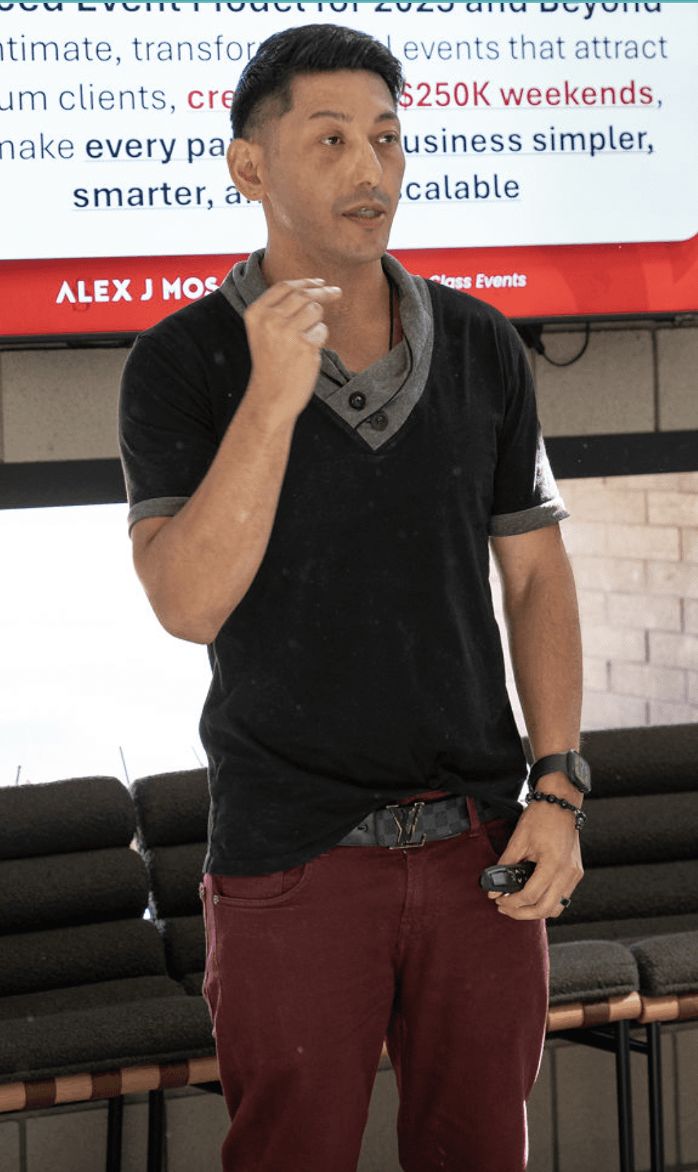 Black and white portrait of a smiling person with curly hair