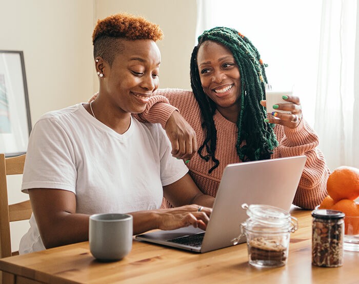 happy gay couple at table