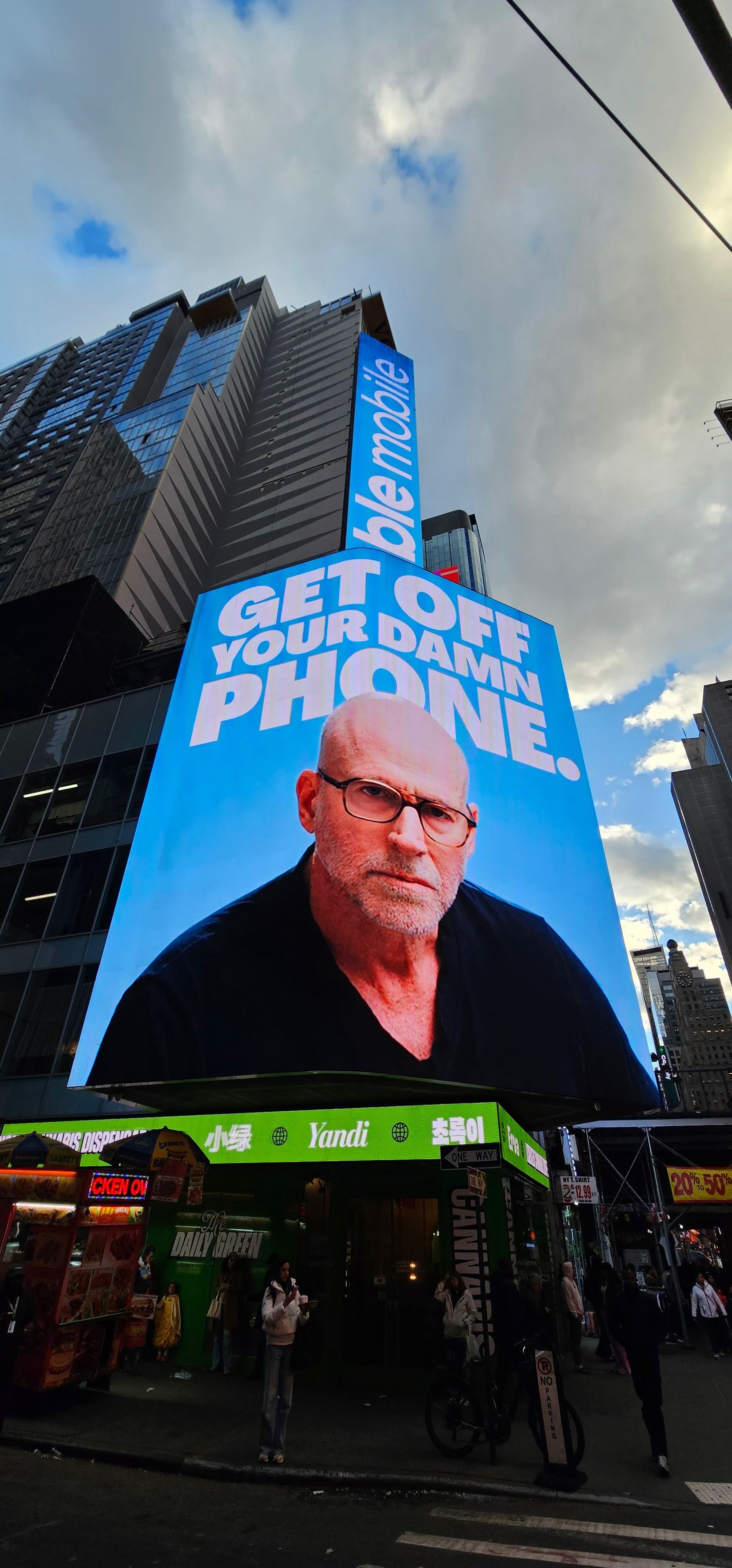 Scott Galloway featured on a large Noble Mobile Times Square billboard.
