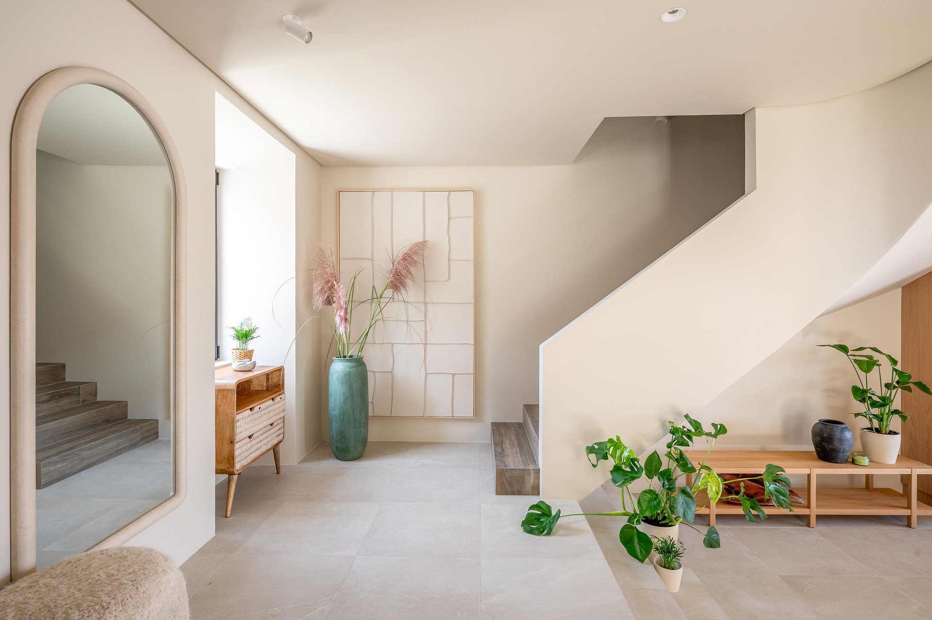 Minimal hallway with stairs and plants at Villa Flora