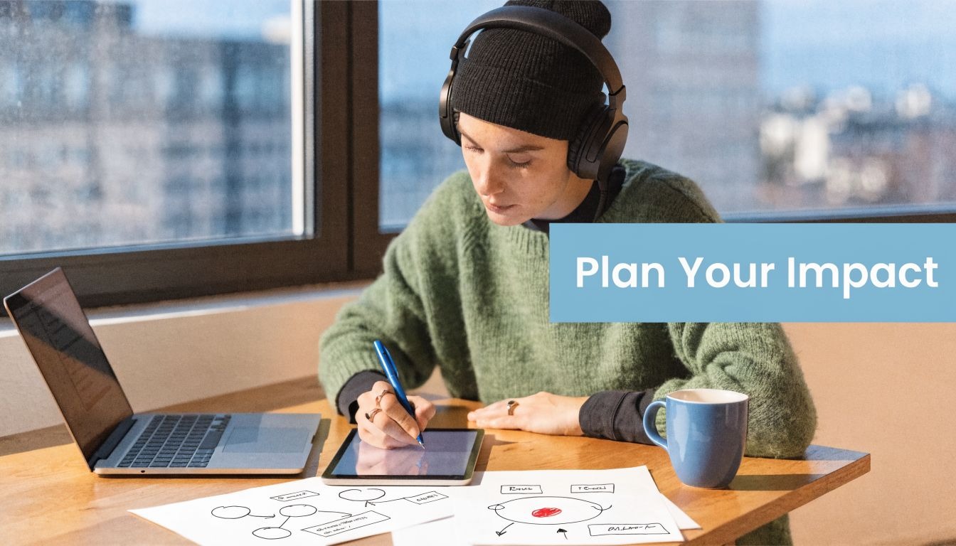 A person wearing headphones works at a desk with a laptop and digital tablet planning their strategy.