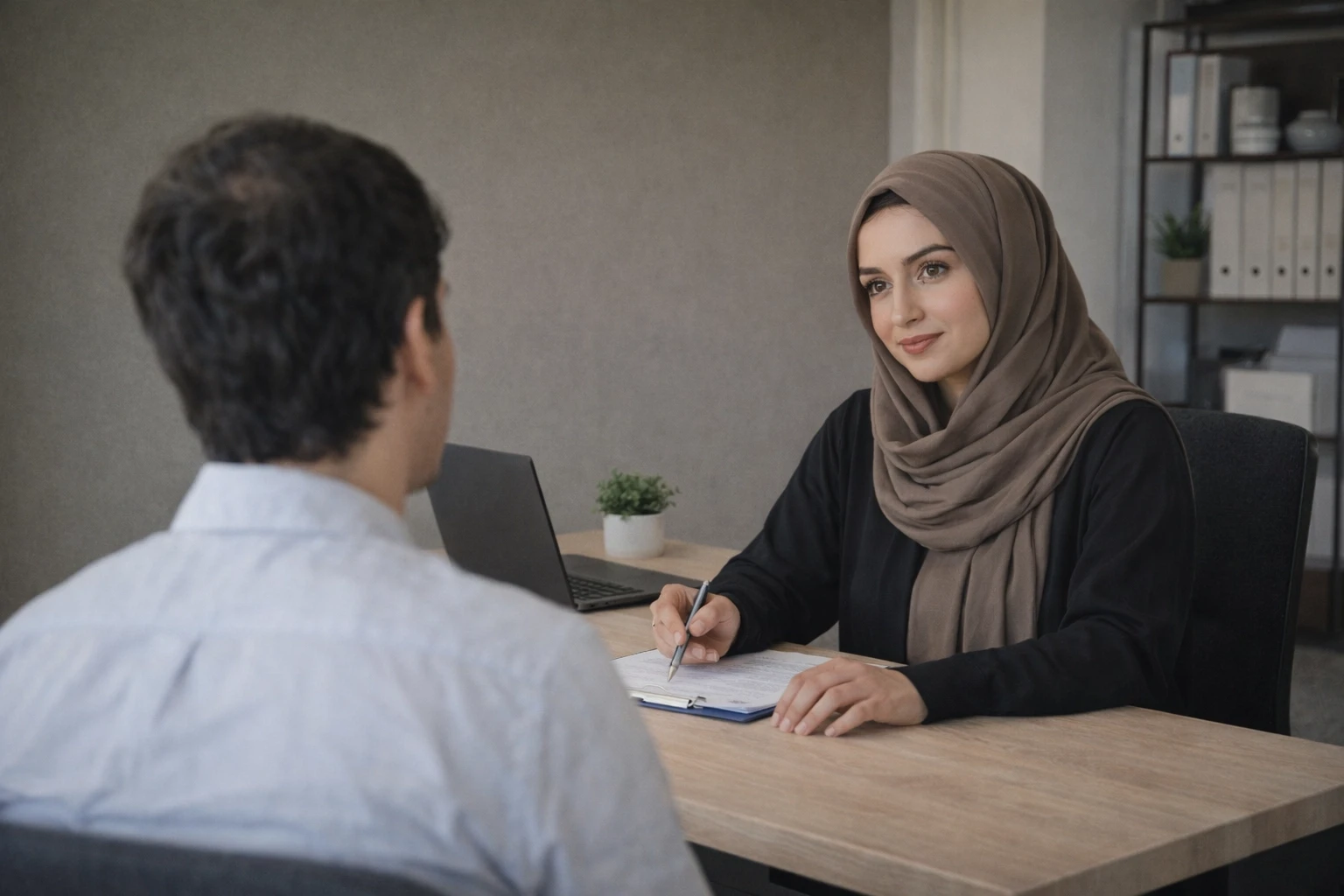 Image of Alrizq team consulting a customer