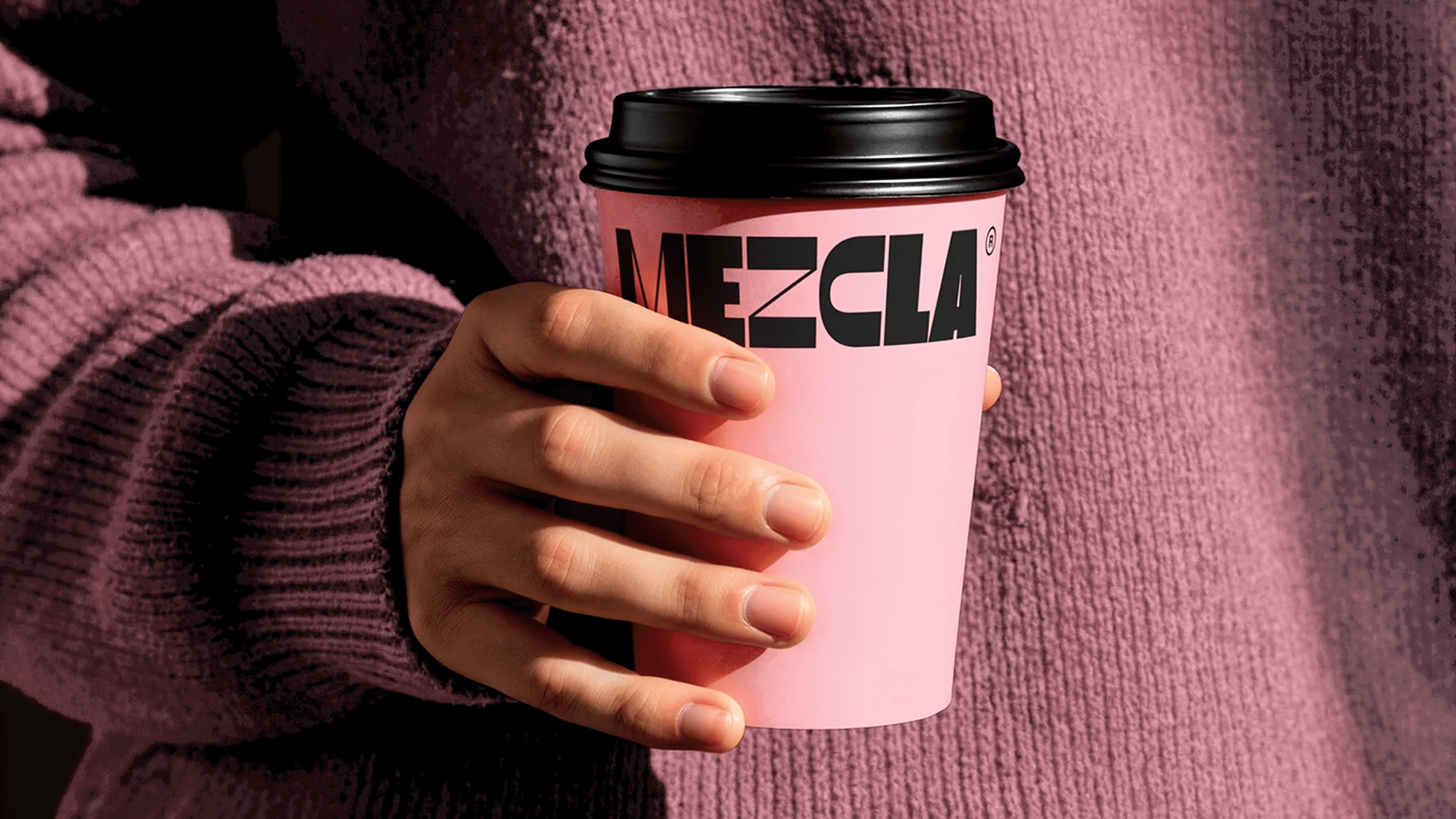 a woman holding a red flower