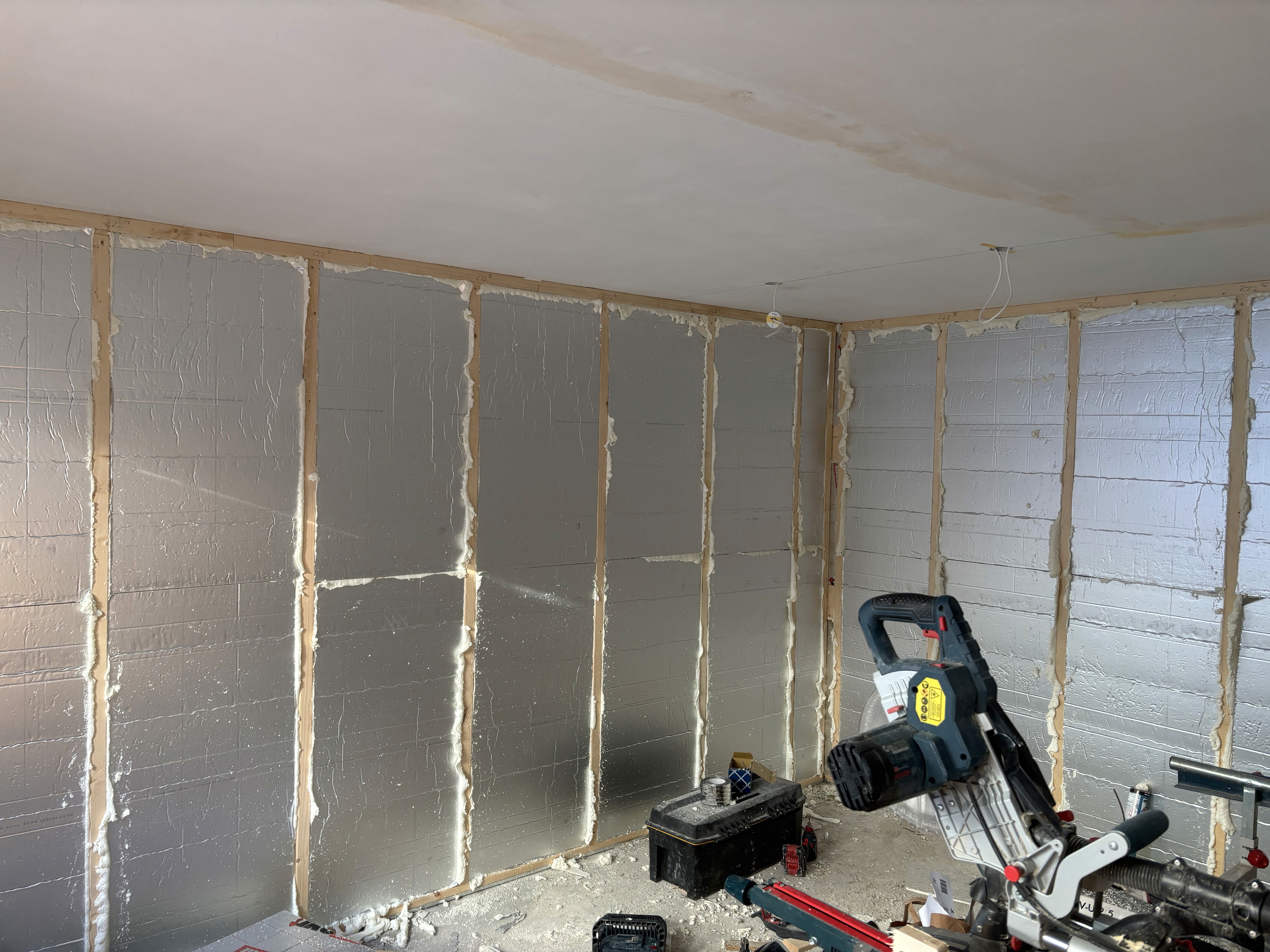 two people looking at a tablet and smiling