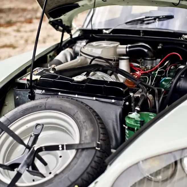 Under the bonnet of a DS shwing the engine and wiring