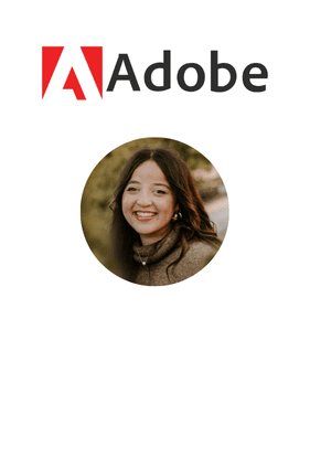 A man in a blue bomber jacket stands against a dark background. The lighting is dramatic, highlighting his focused expression. His pose is confident.