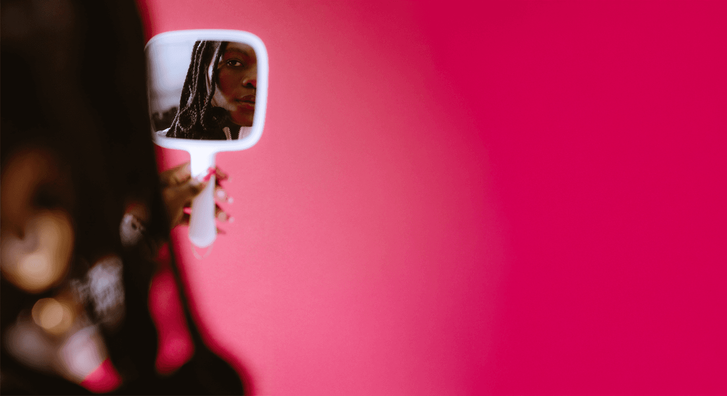 Creative background with Dali Adekunle holding a mirror about section on creative philosphy to show skills, awards and publications