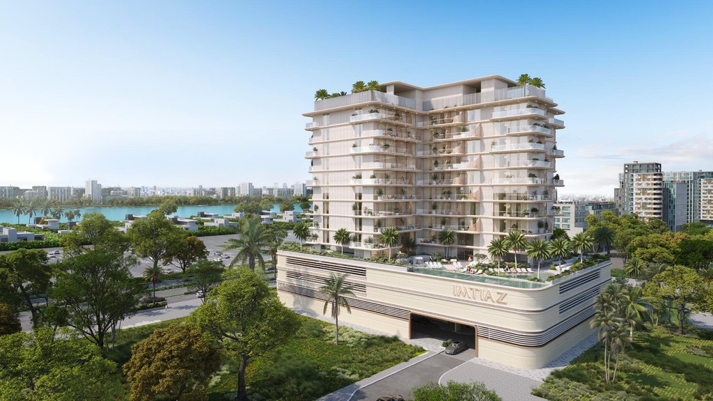 New apartment building Sunset Bay Grand in Miami, showcasing modern architecture against a vibrant skyline.