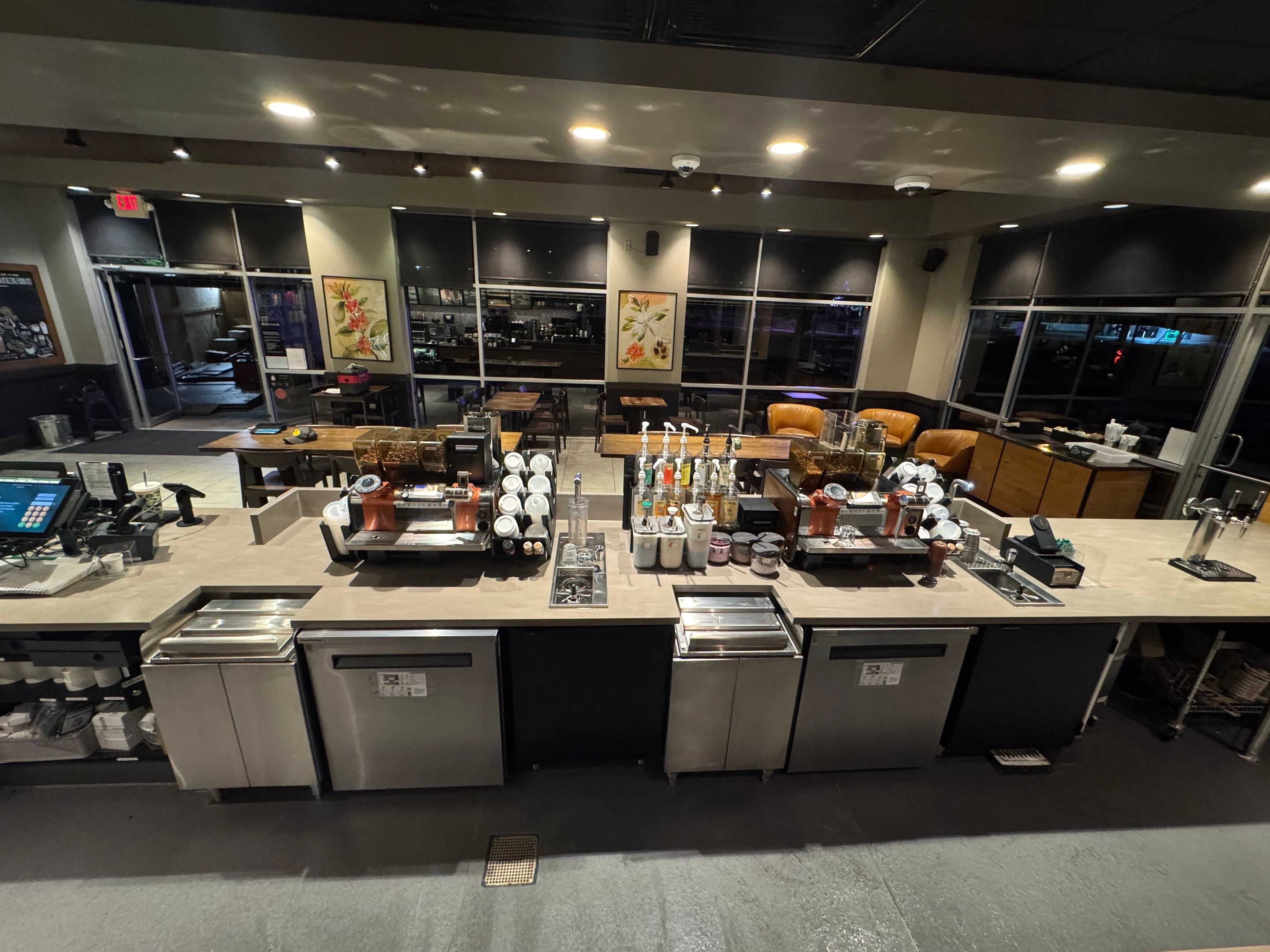 Wide view of completed Starbucks countertop installation showing full beverage station layout with clean lines, durable surfaces, and organized equipment setup.