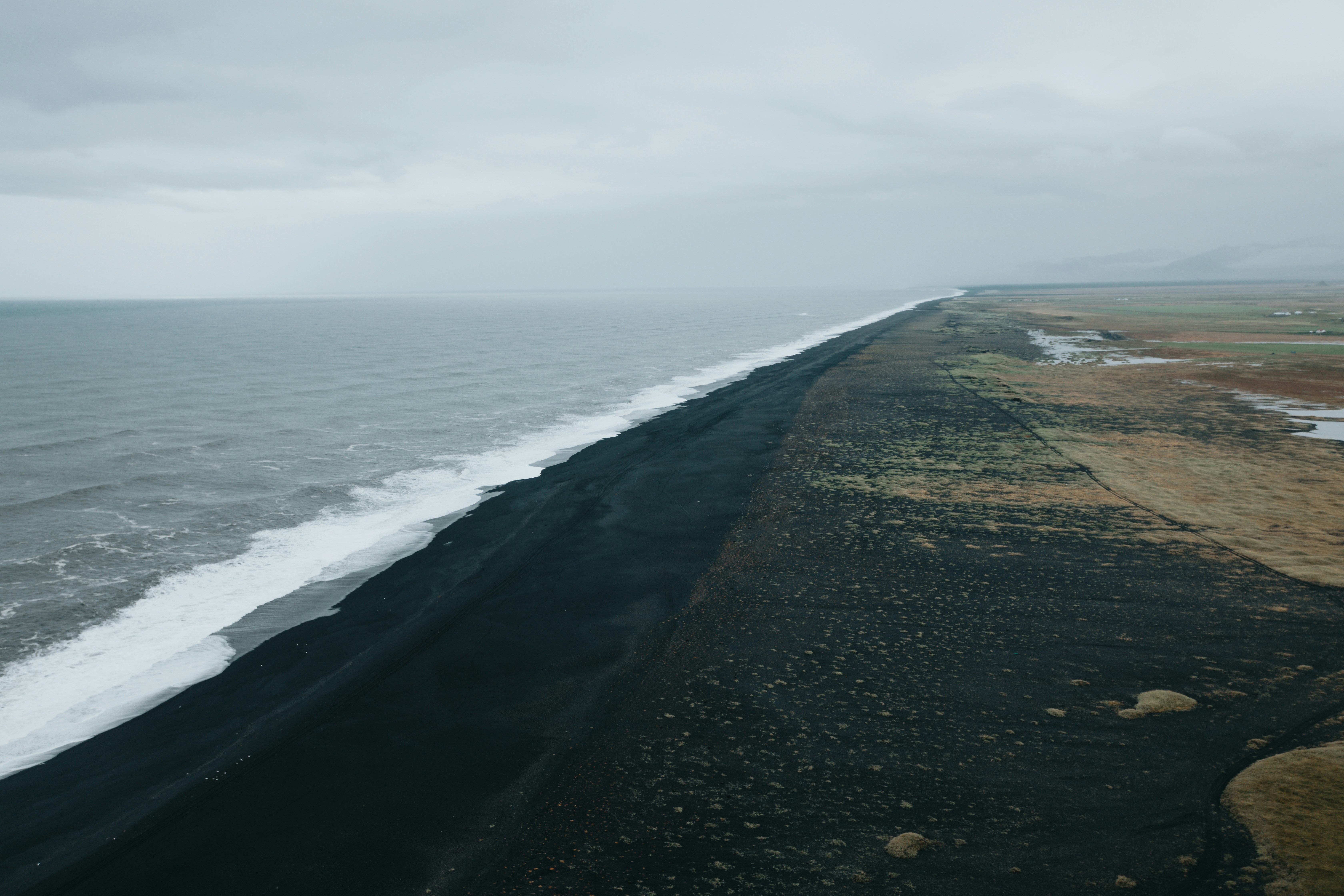 A long stretch of black sand beach in South Iceland.