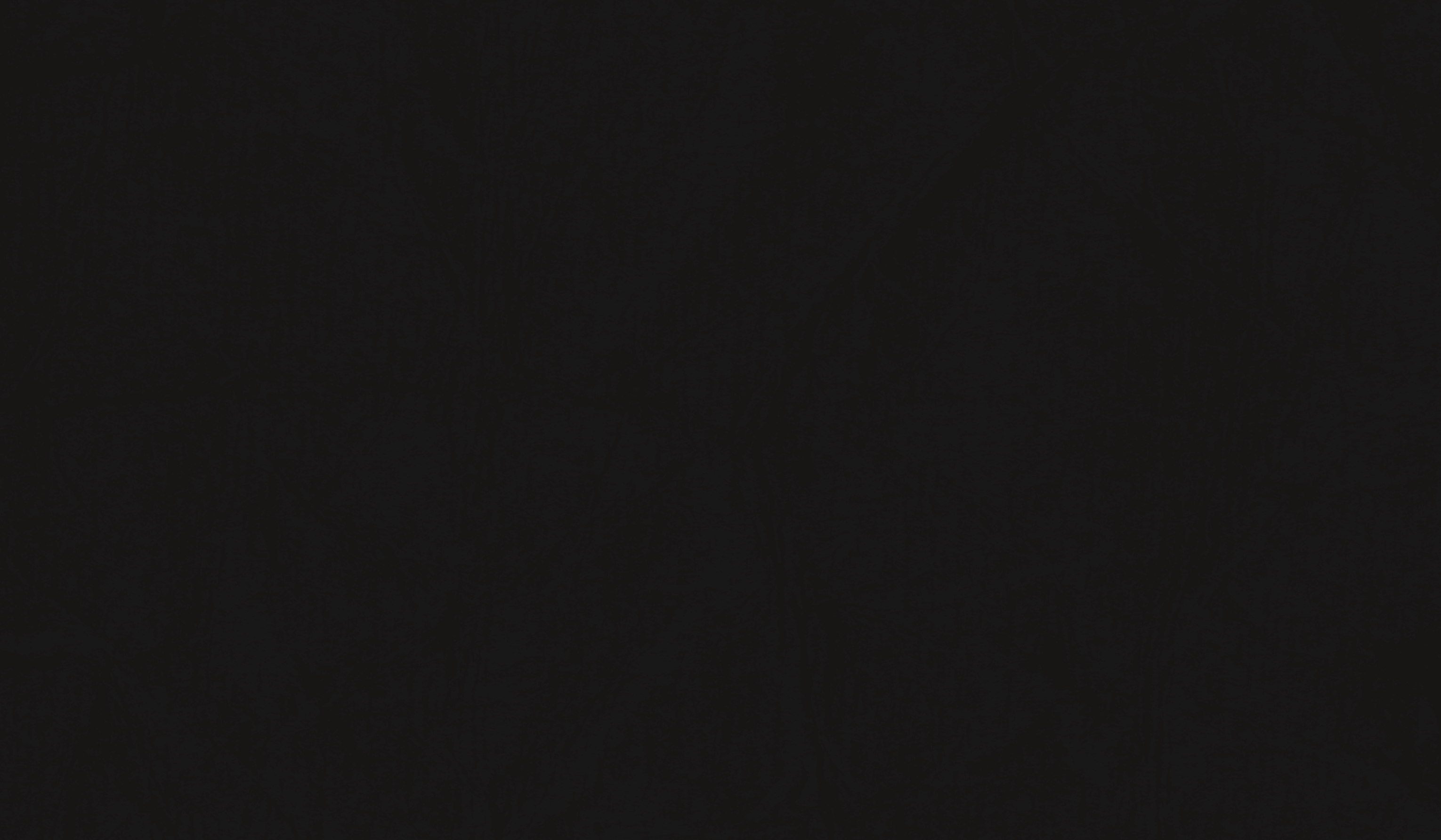 a couple of bottles sitting on top of a wooden table