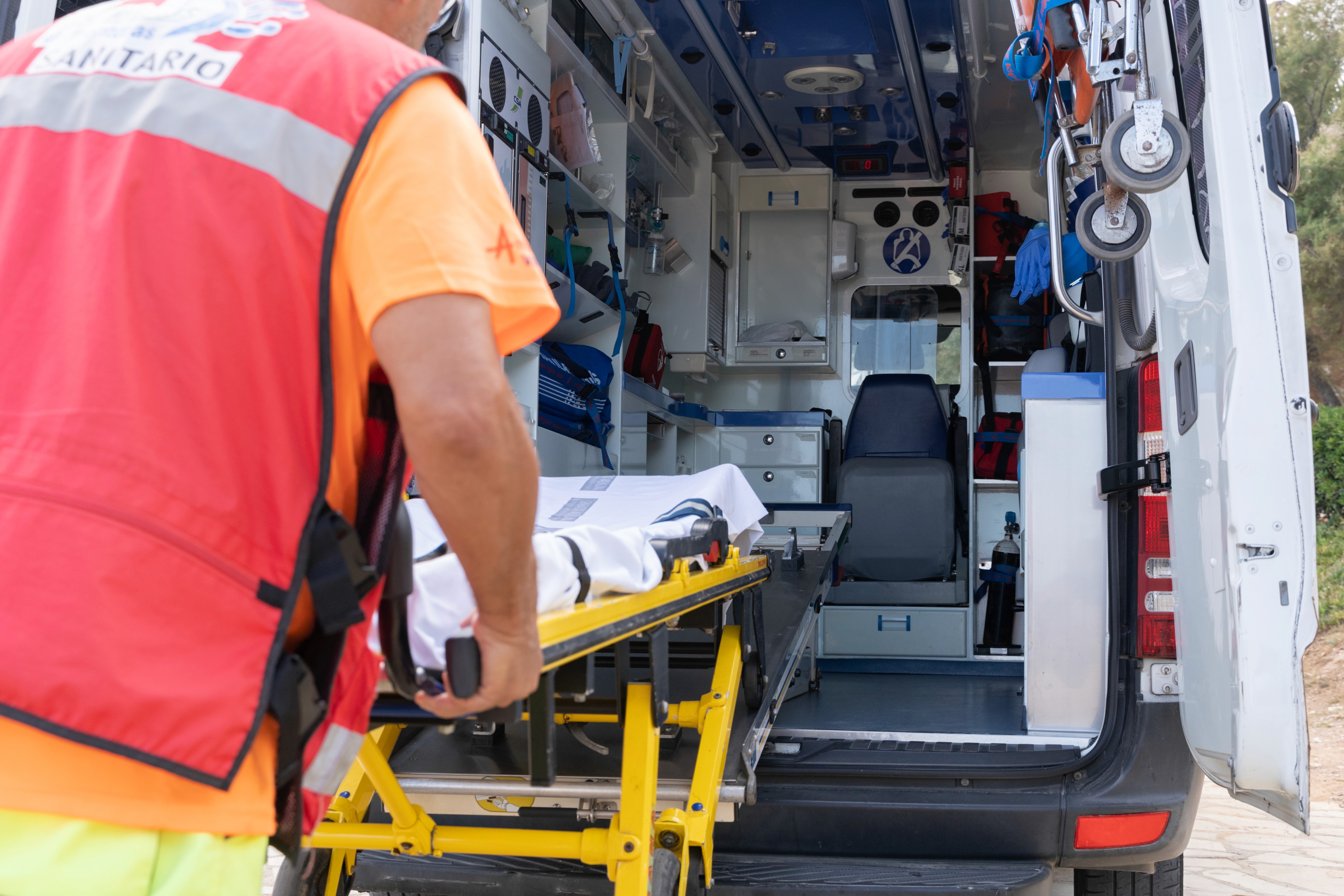 Paramedic Prepares Ambulance Stretcher for Medical