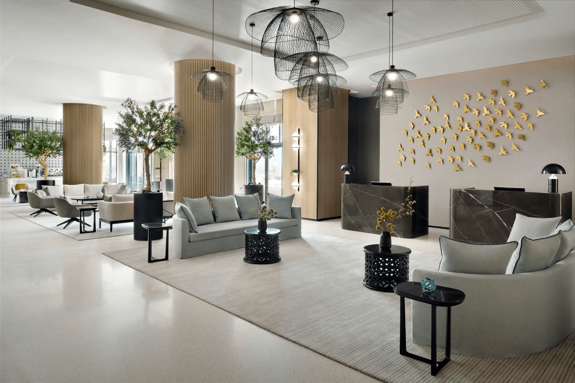 Lobby of Vida Emirates Hills, a stylish pet-friendly hotel with soft neutral interiors and modern seating.