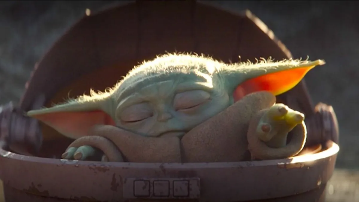 Grogu, known as “The Child” at the time, sleeps peacefully inside his floating pram. His first appearance in The Mandalorian sparked an instant cultural phenomenon.