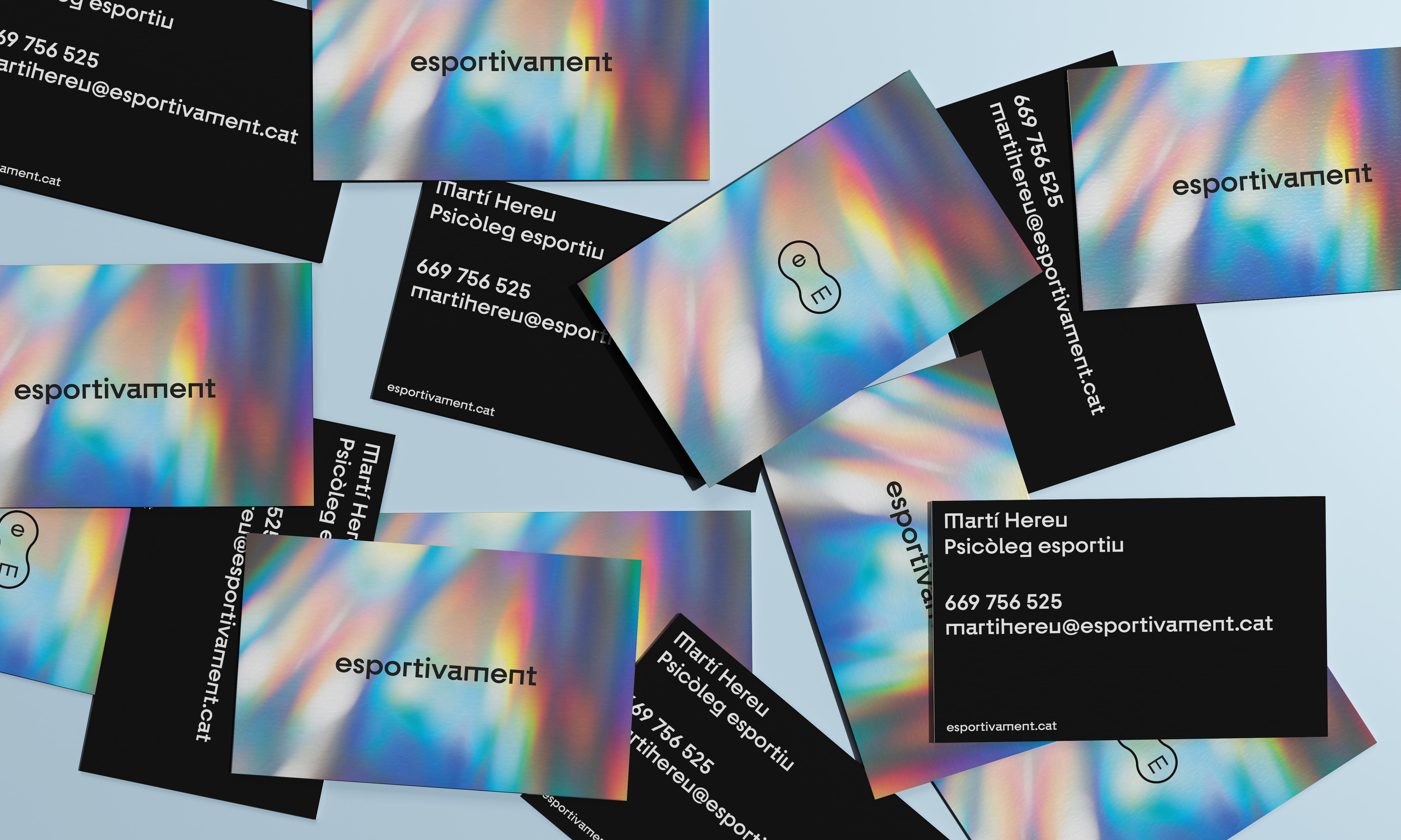 A close-up of a hand wearing multiple decorative rings against a blue background.