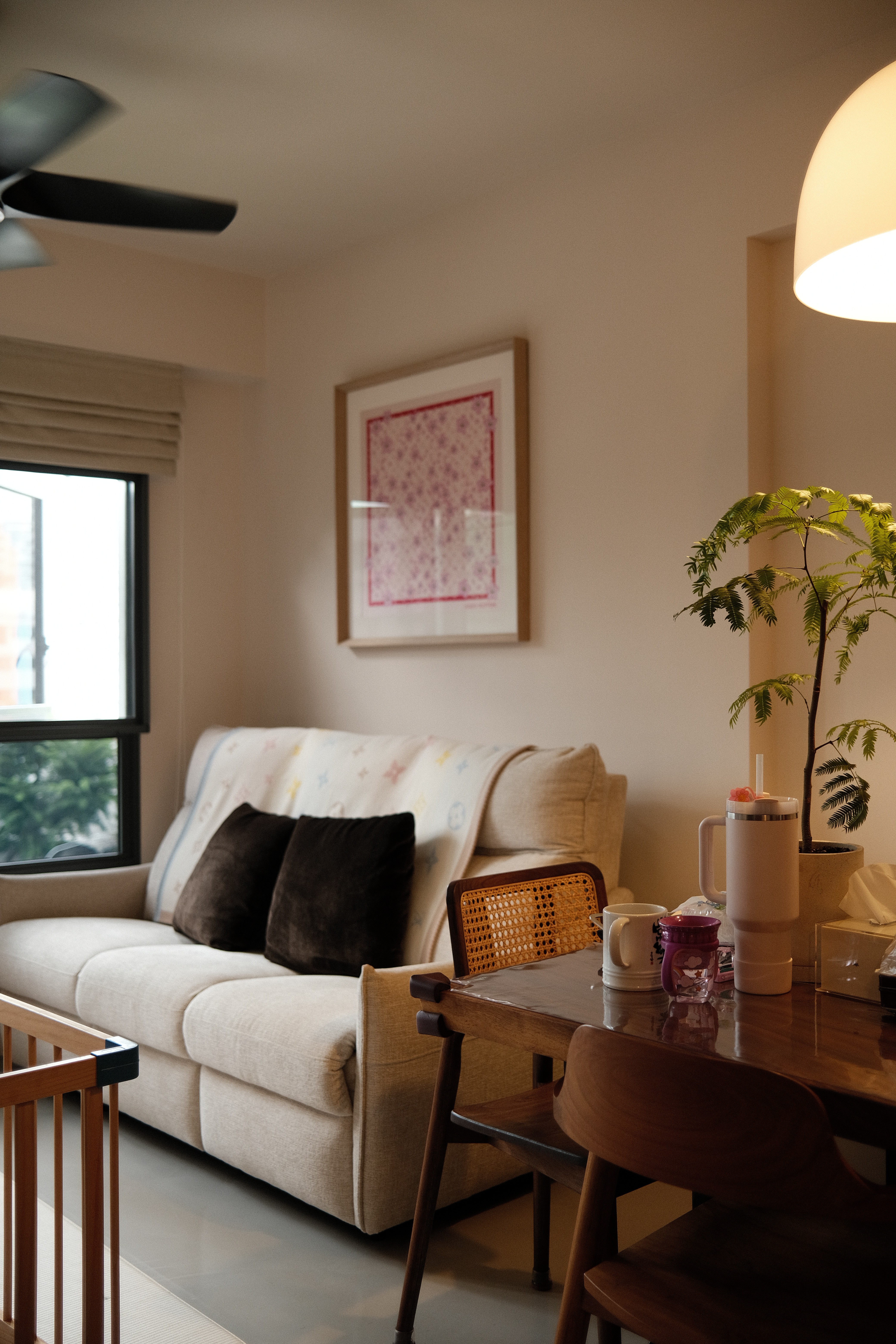 A calm, light-filled living space where soft neutrals, warm wood tones, and gentle greenery create an inviting everyday retreat.