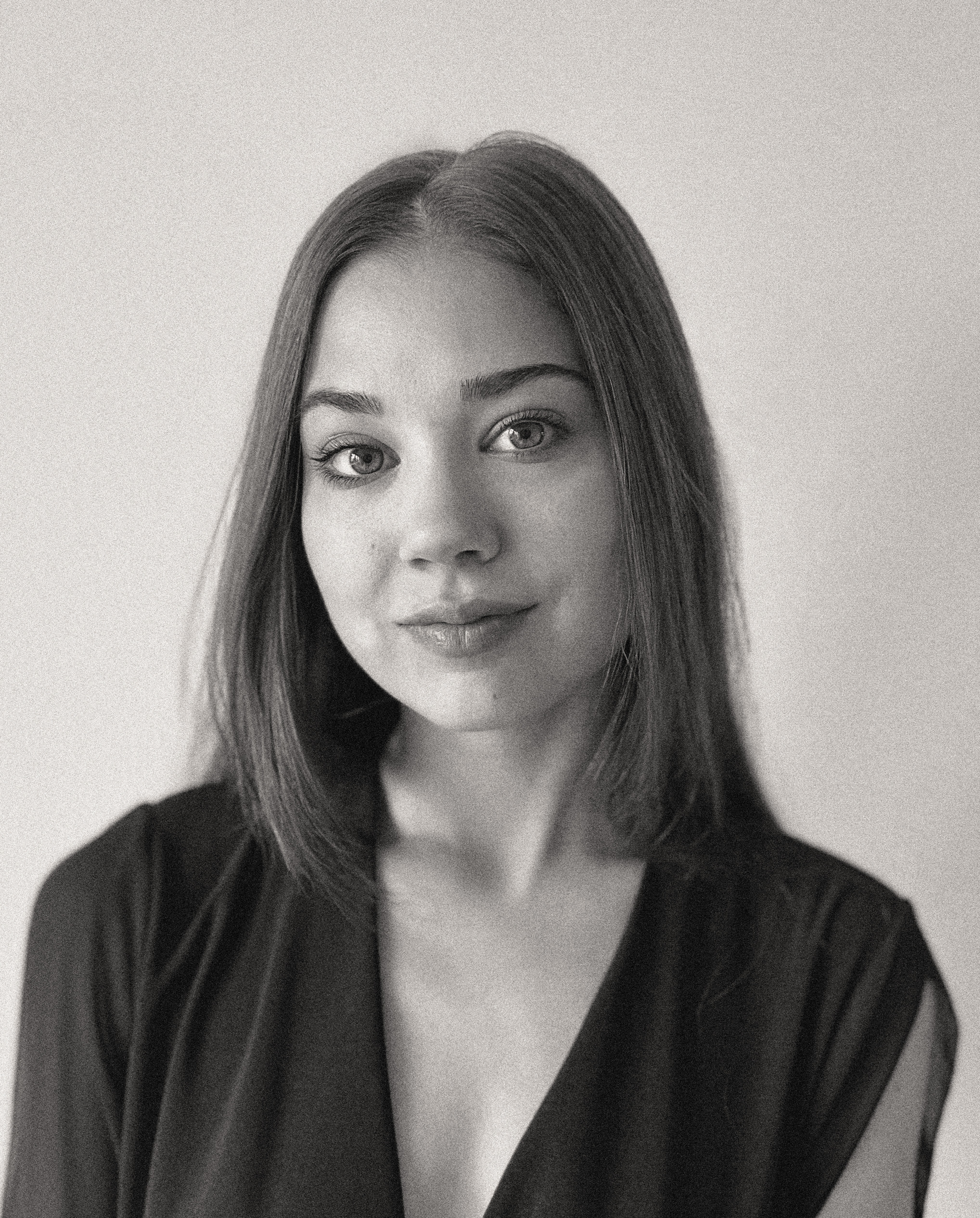 a blurry photo of a person standing in front of a wall