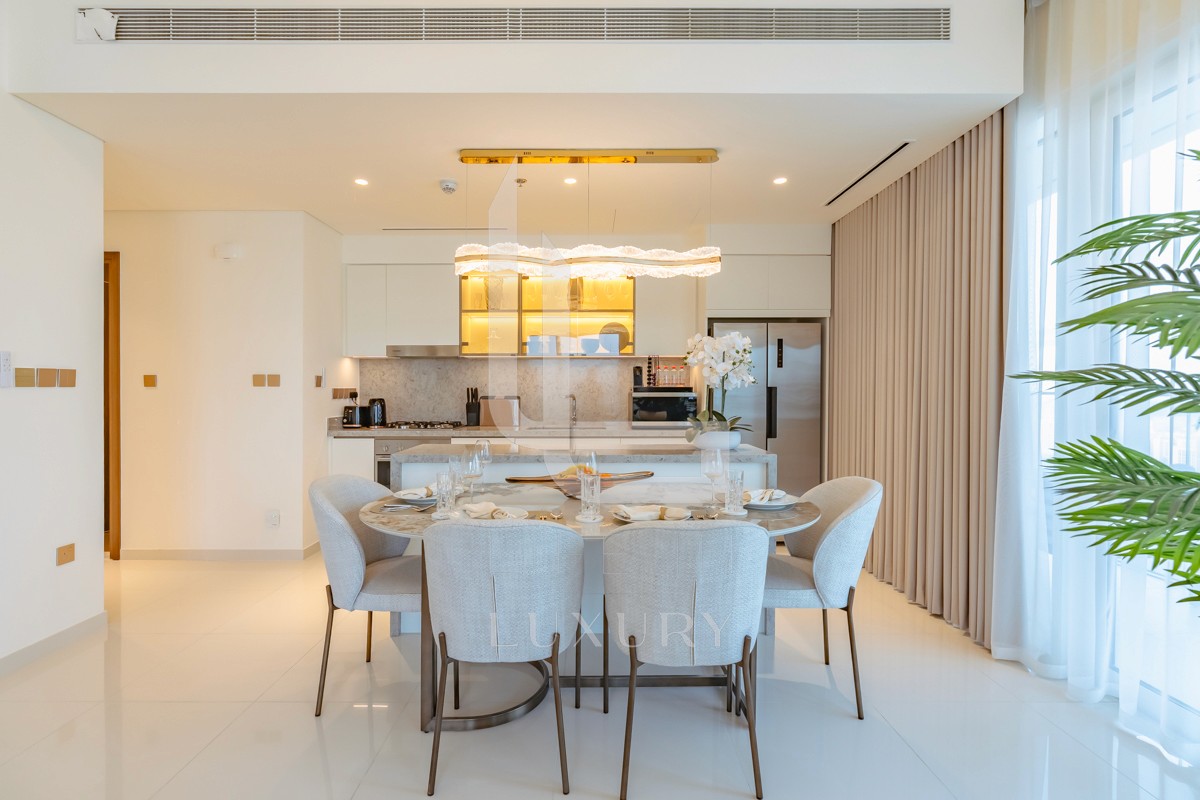 Explore this stylish dining area with a modern table and comfy chairs, perfect for enjoying meals with family and friends.