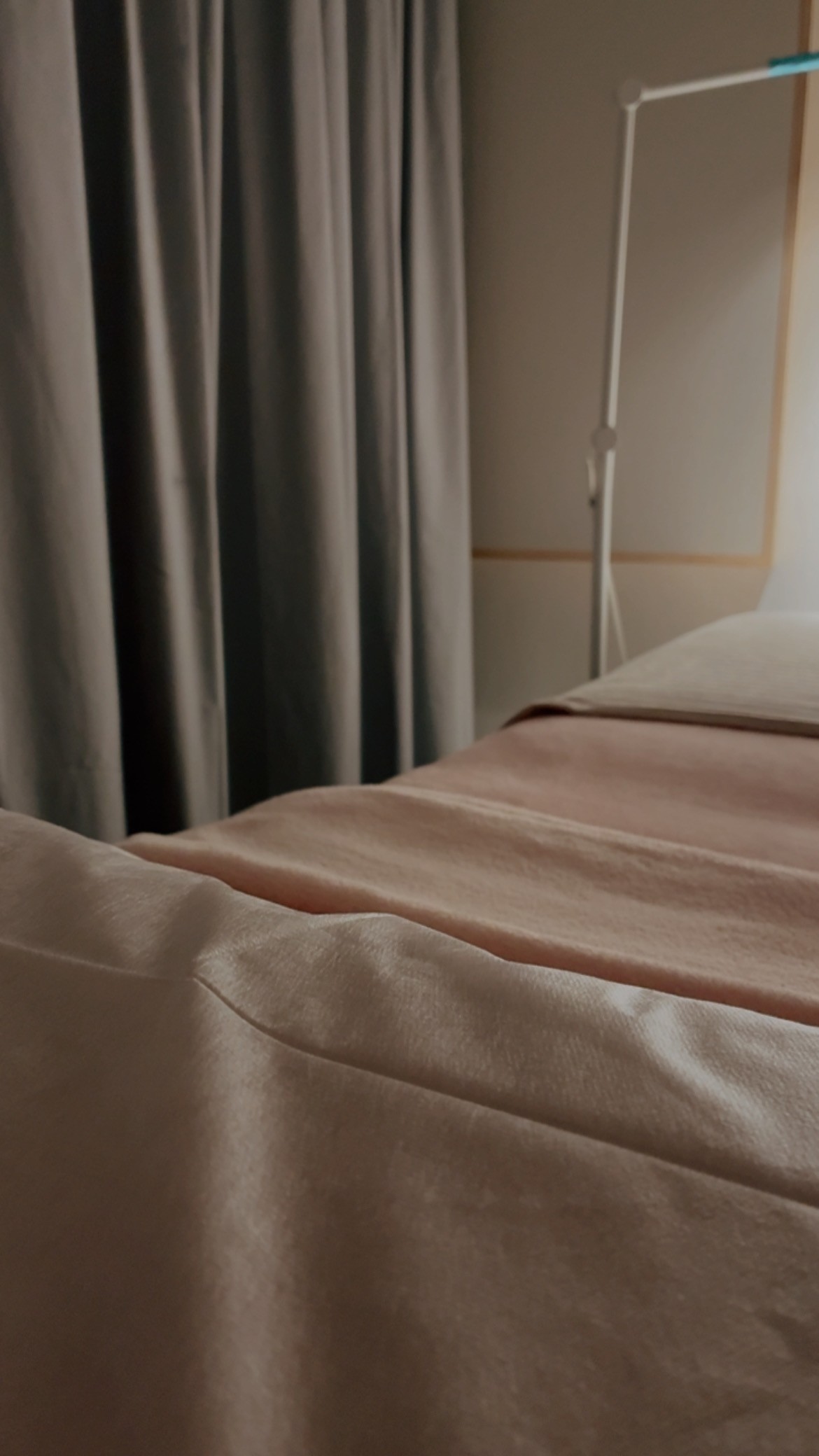 Treatment bed in a clean, minimal studio room