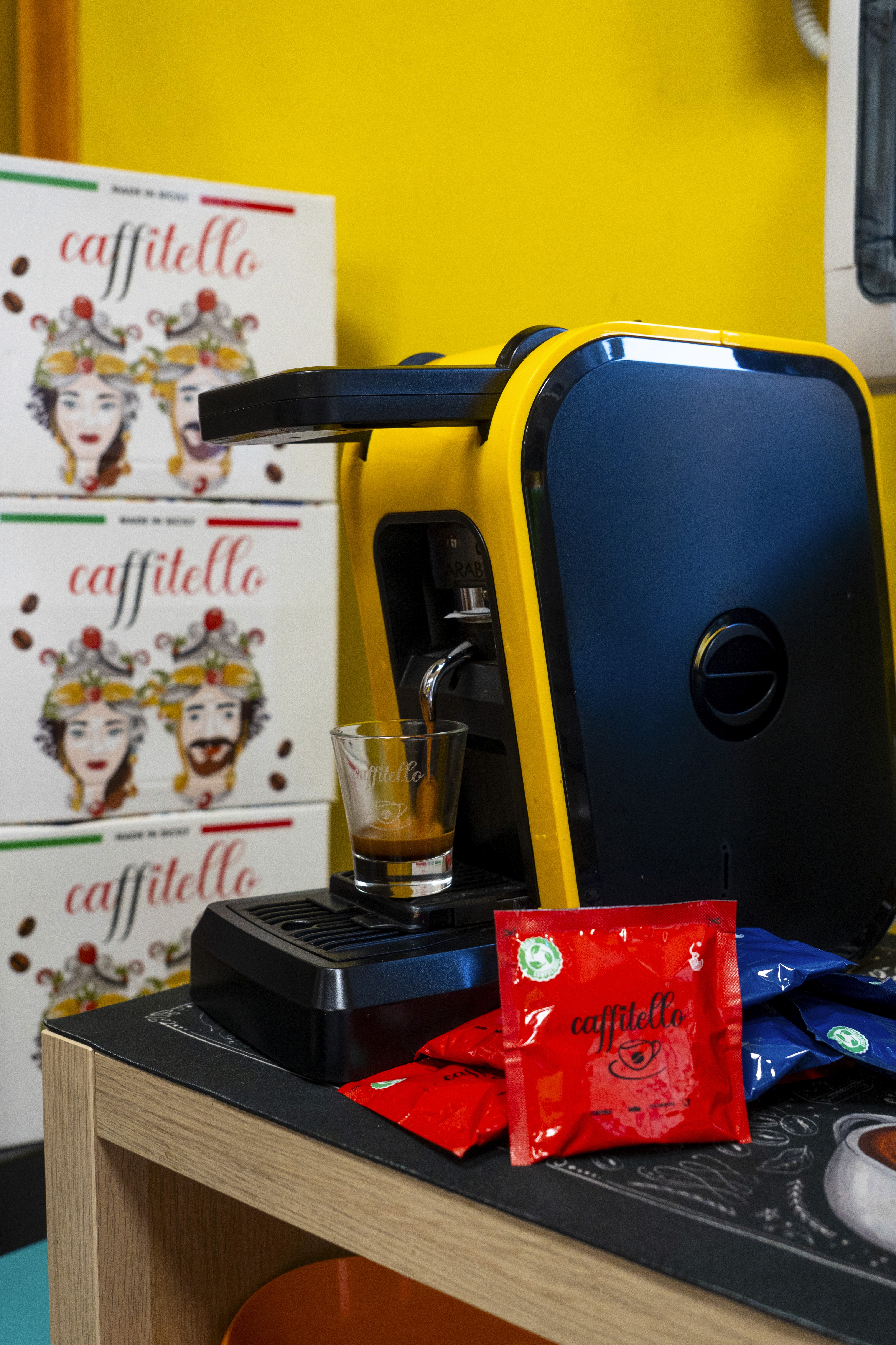 Barista in mask preparing coffee with moka pot