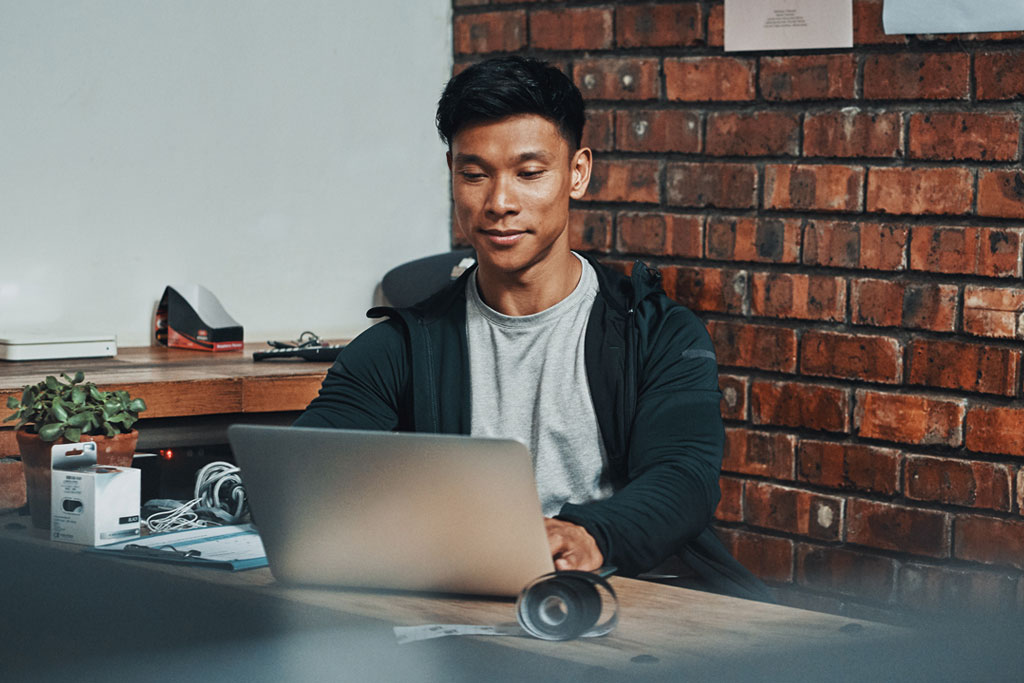 Gym operator using software on a laptop