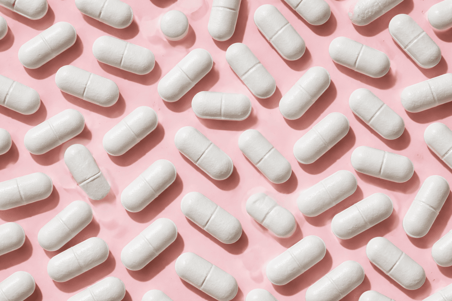 A colorful assortment of vitamins and supplements in various shapes and sizes.