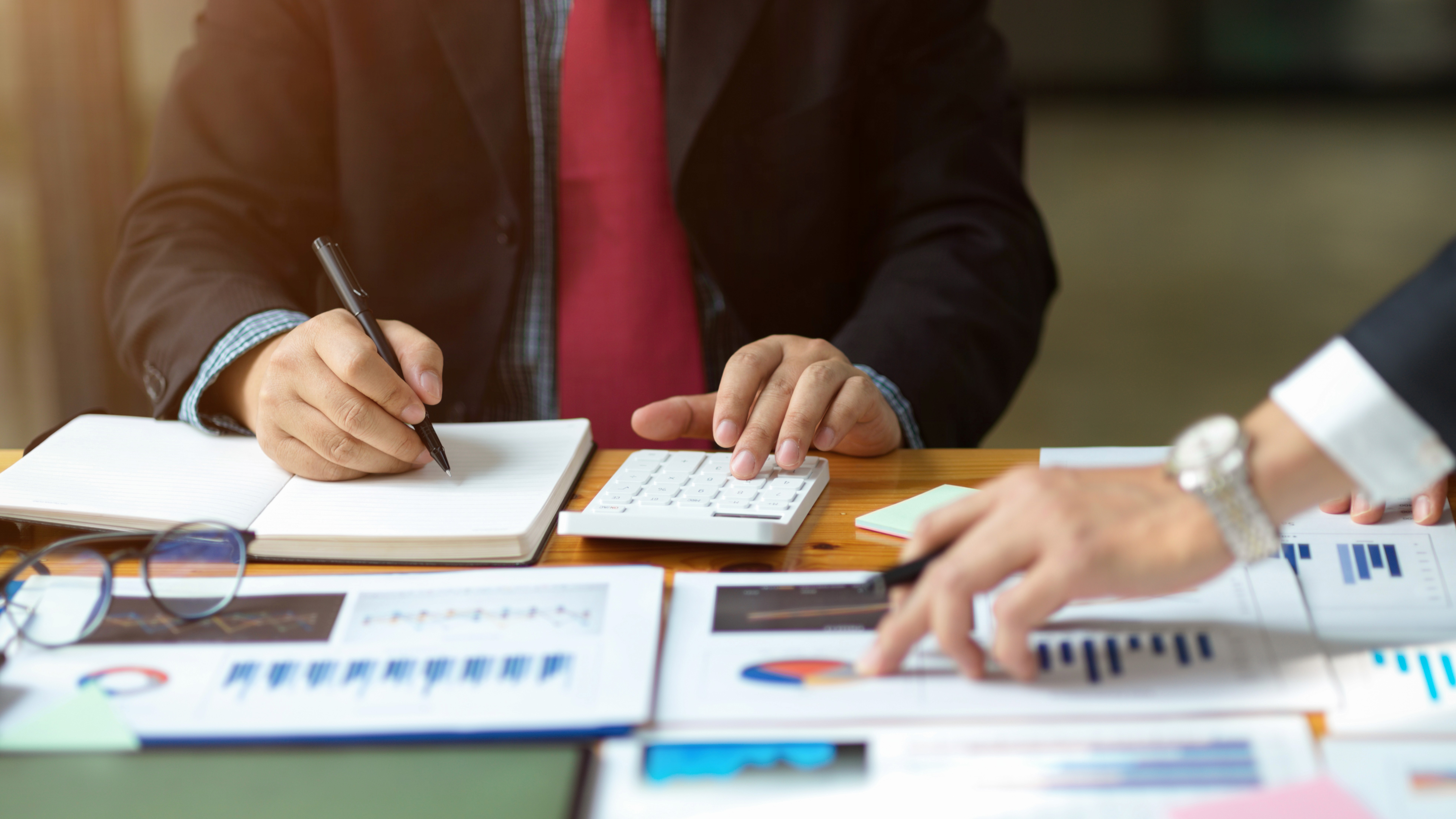 Bachelor of Business Administration (BBA) representing business professionals analyzing financial data, planning strategies, and managing accounts in an office setting.