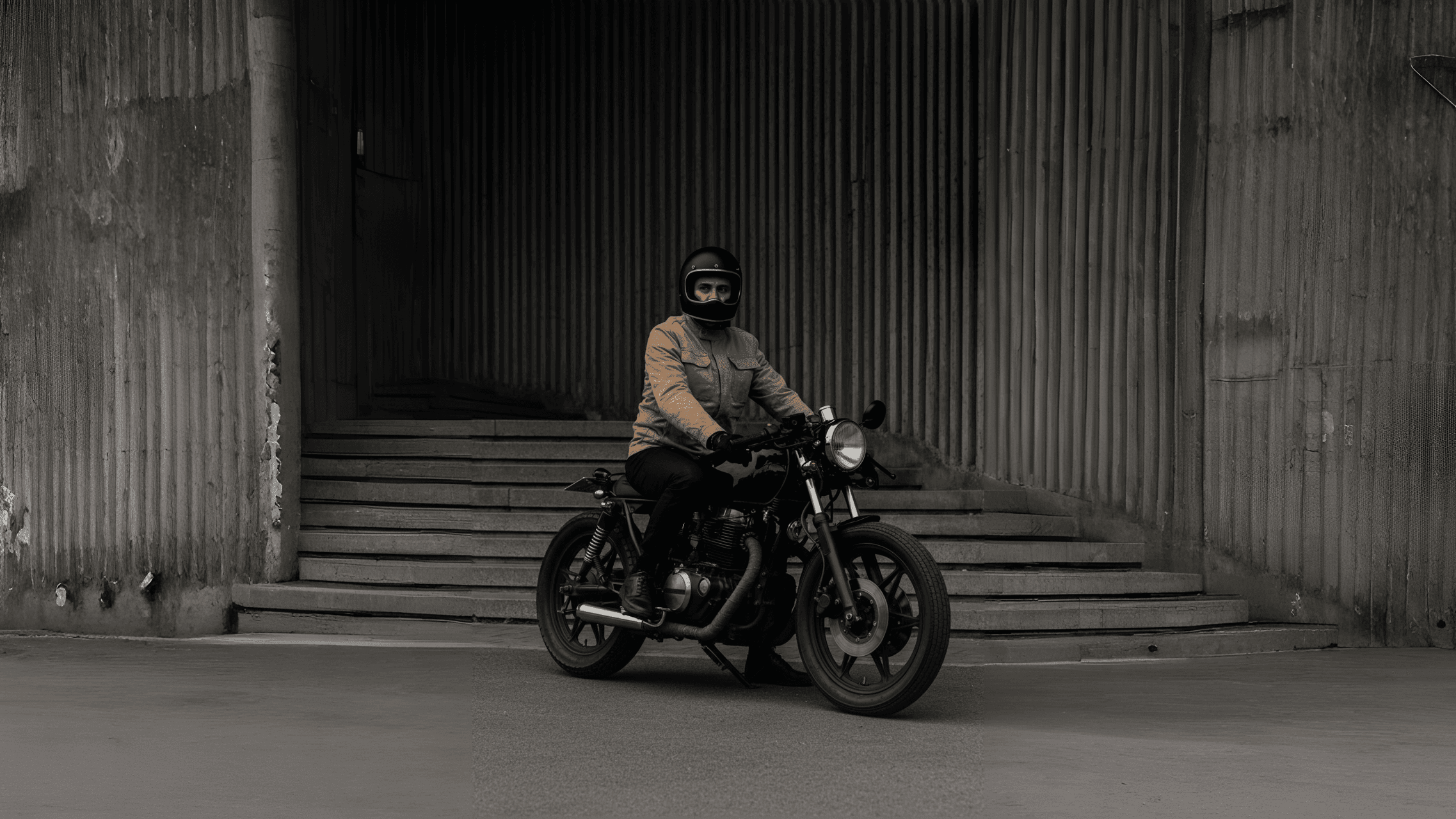 Man sitting on a motorcycle.