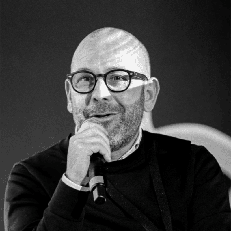 A person wearing the white shirt looking at the left