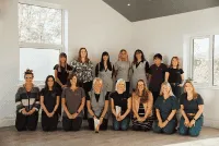 a man sitting on a motorcycle in a parking garage