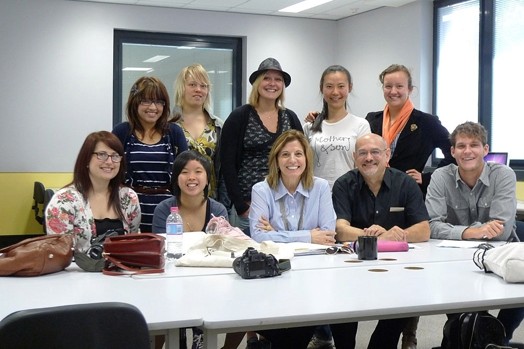 A photo of a group of people sitting at a table.