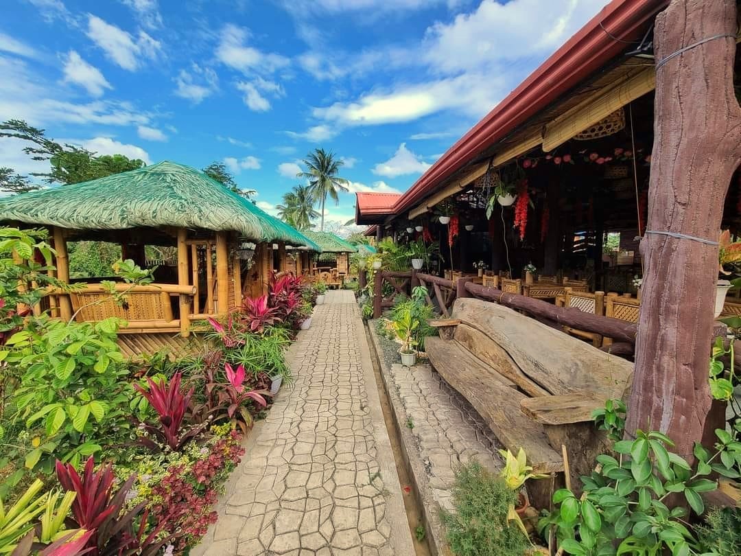 a photo of a clear sky, huts, and beautiful scenery in Sadati Forest Indang, Cavite