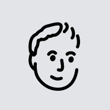 a man with a goatee smiles at the camera