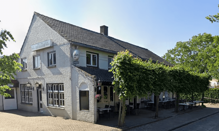 man wearing gray polo shirt beside dry-erase board