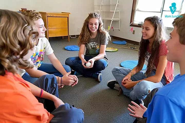 High school students in a RISE Research summer program sitting in a circle, participating in a psychology group activity focused on team bonding and peer learning.