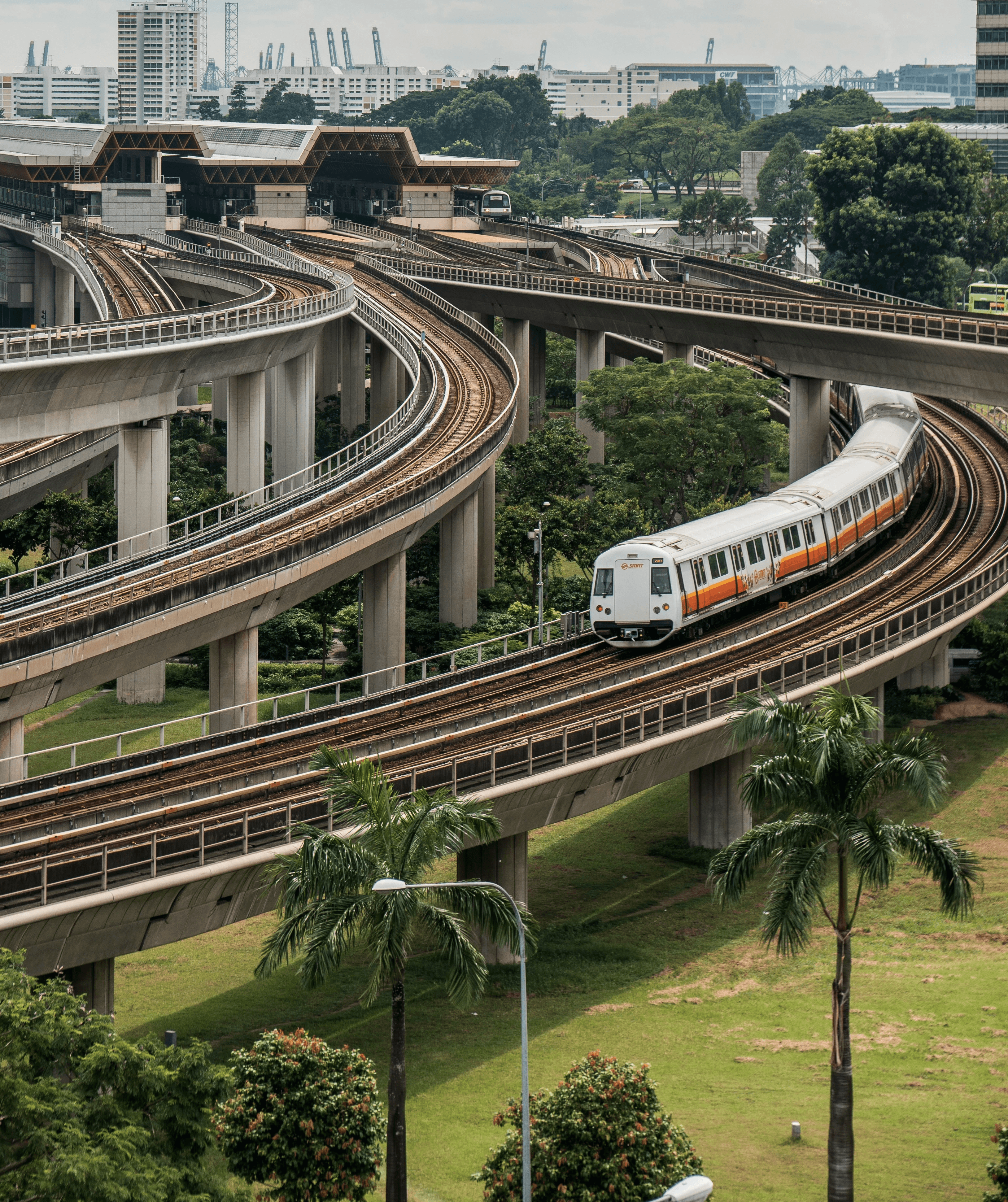 white and red train on rail road during daytime