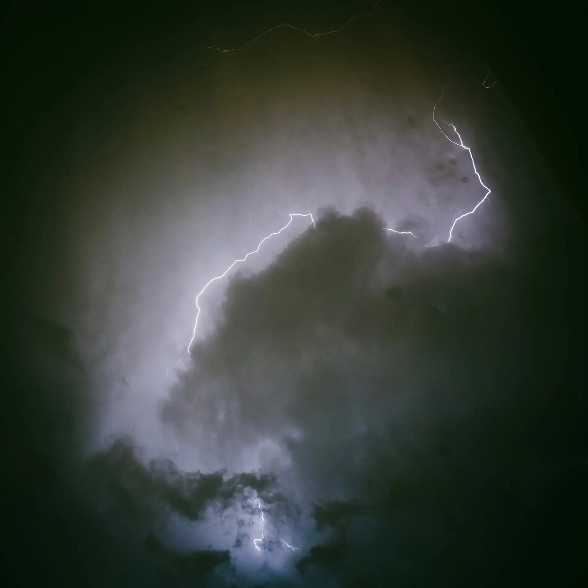 Lightning striking in a cloudy sky.