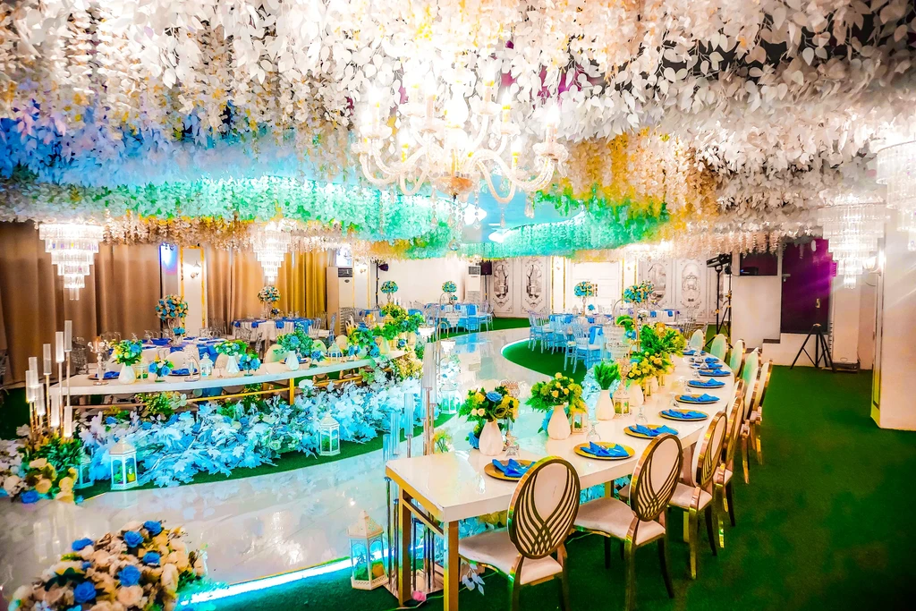 Long banquet tables in warm golden light at Celestia Hall, Quezon City
