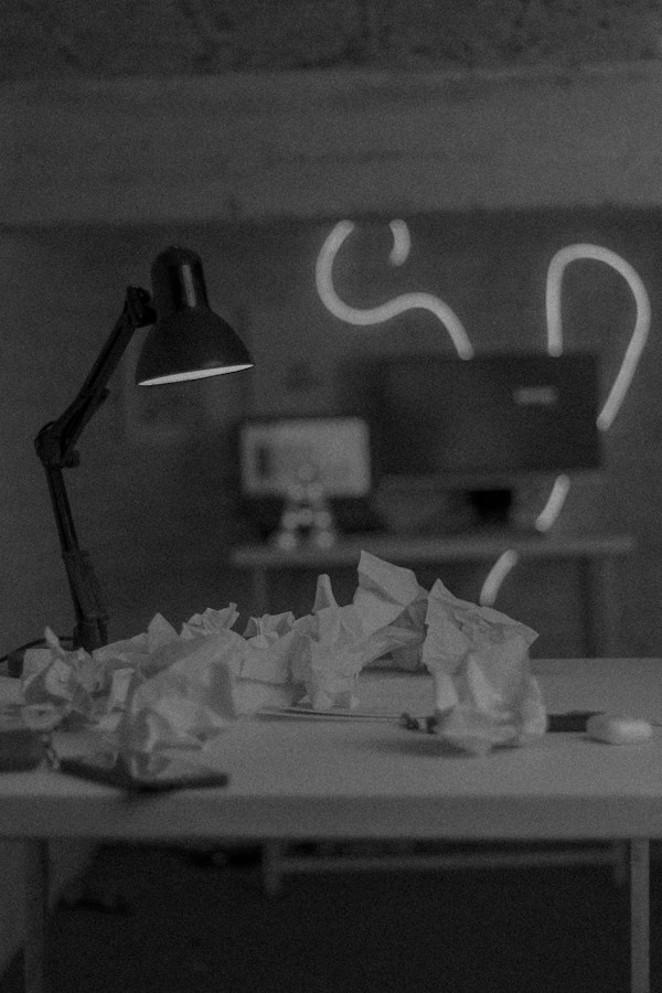 Desk with papers and lamp