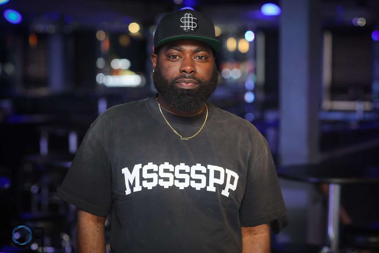 Hollywood Luck in a black cap and Trofees graphic shirt