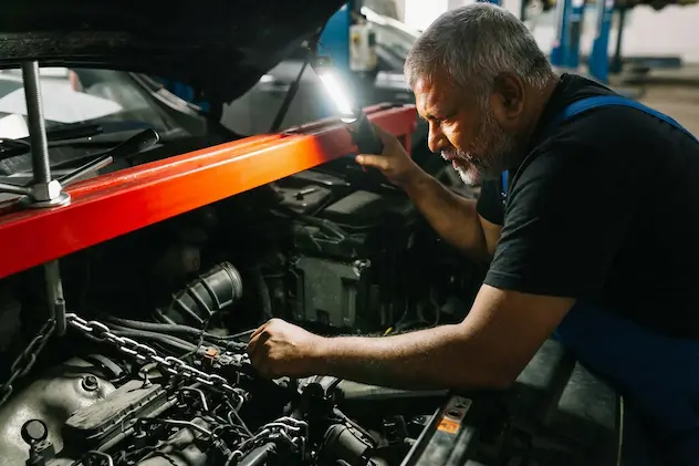 Export checking the engine of a car